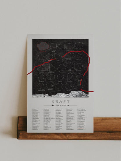 A black color, customized rock climbing ticklist poster for the Kraft rock climbing location at the Red Rocks in Las Vegas, Nevada. The design has an overlay of crag topography, nature landscapes, and traced boulders, the person's name, and a list of bouldering problems at the bottom. Displayed as wall art in a living room.